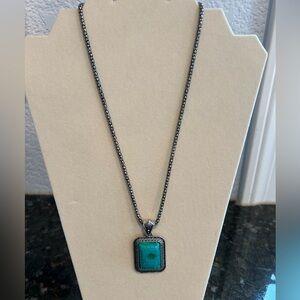 Faux turquoise and chunky silver colored chain. Pendant. Beautiful necklace!